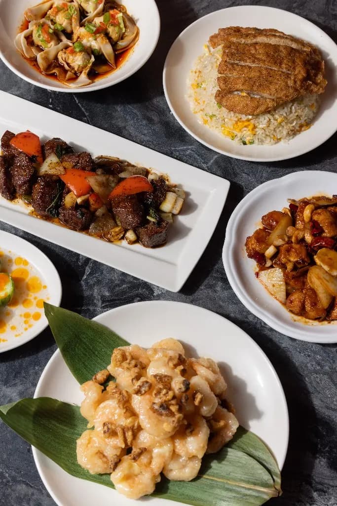 A spread of beef, prawns, dumplings, and rice